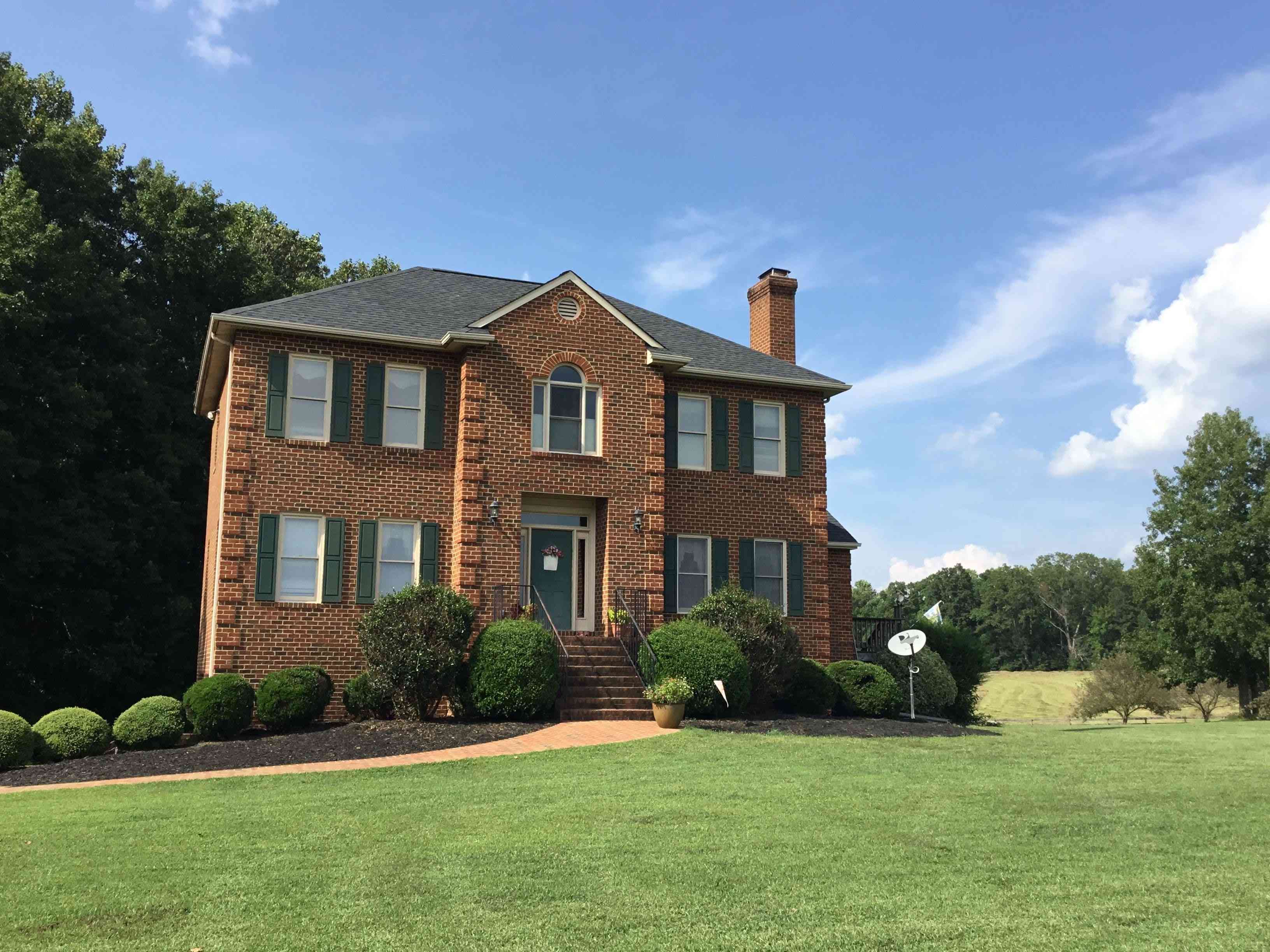 Colonial style home under blue sky