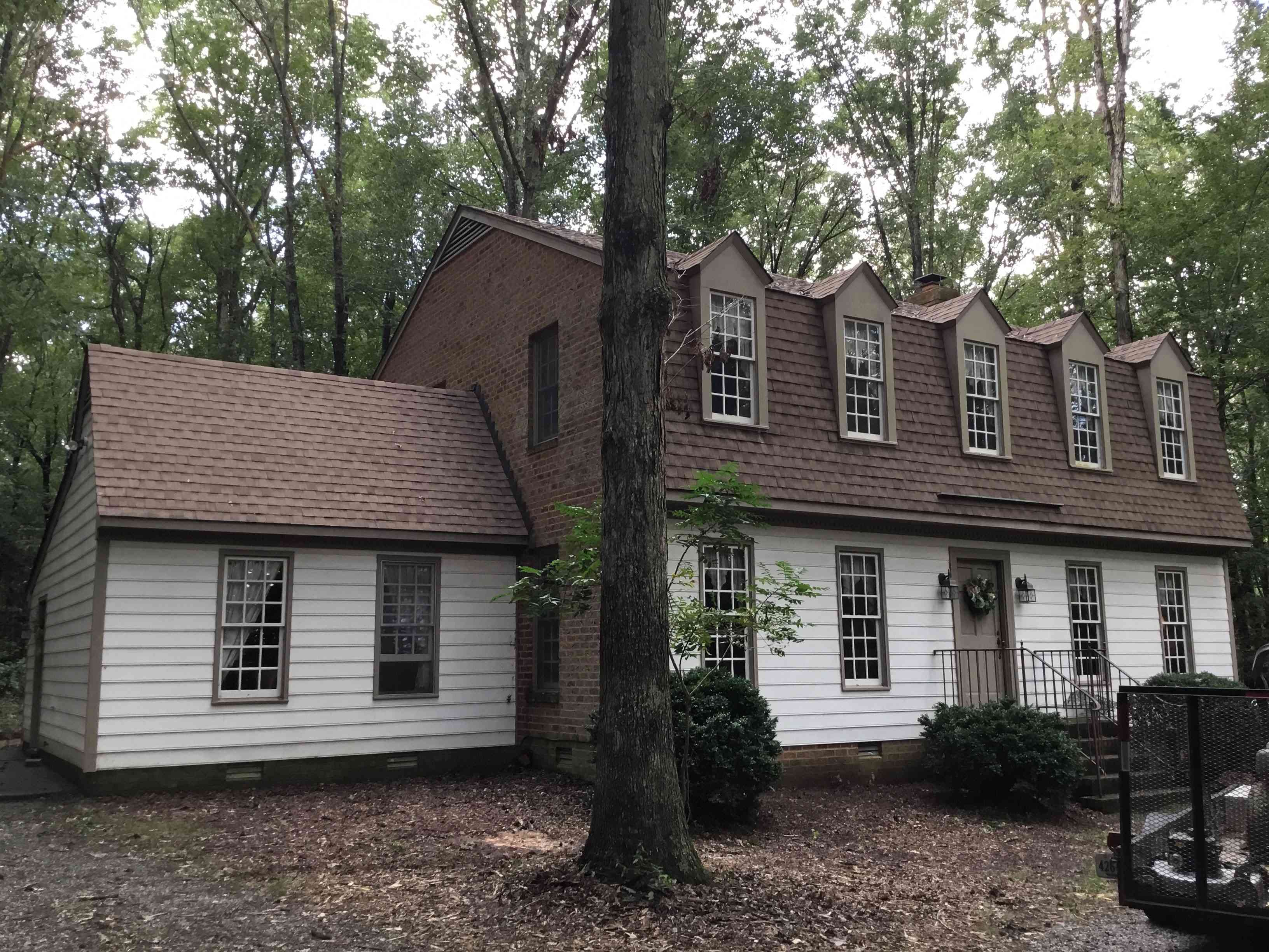 Colonial style home in the woods